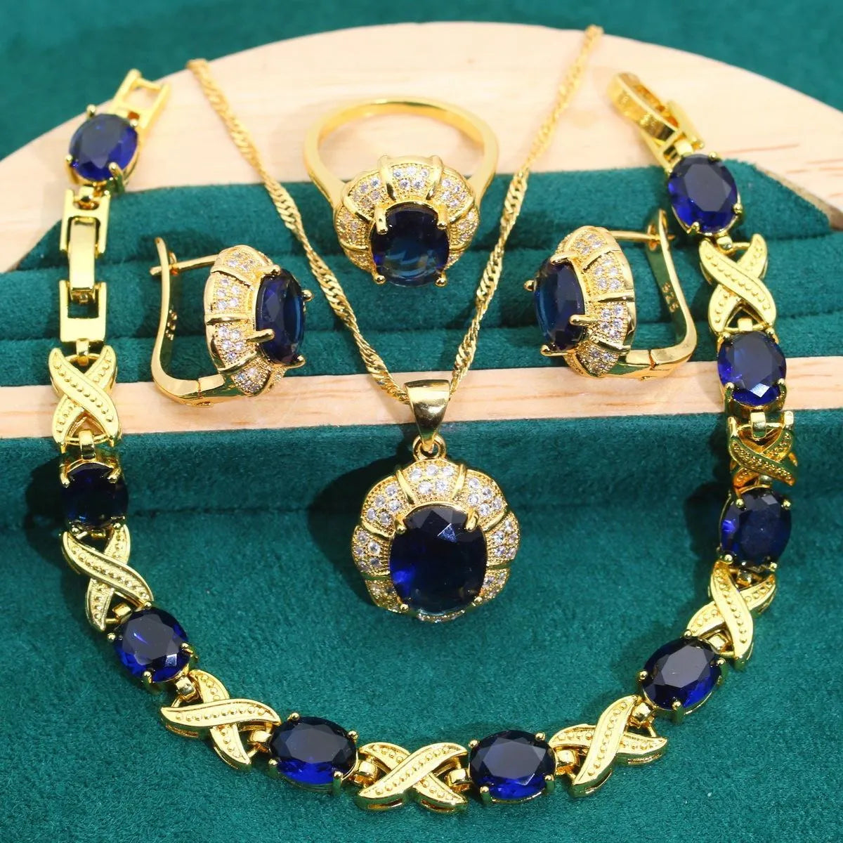 18k gold plated jewellery set with cubic zirconia stones, showing necklace, earrings, bracelet, and ring.
