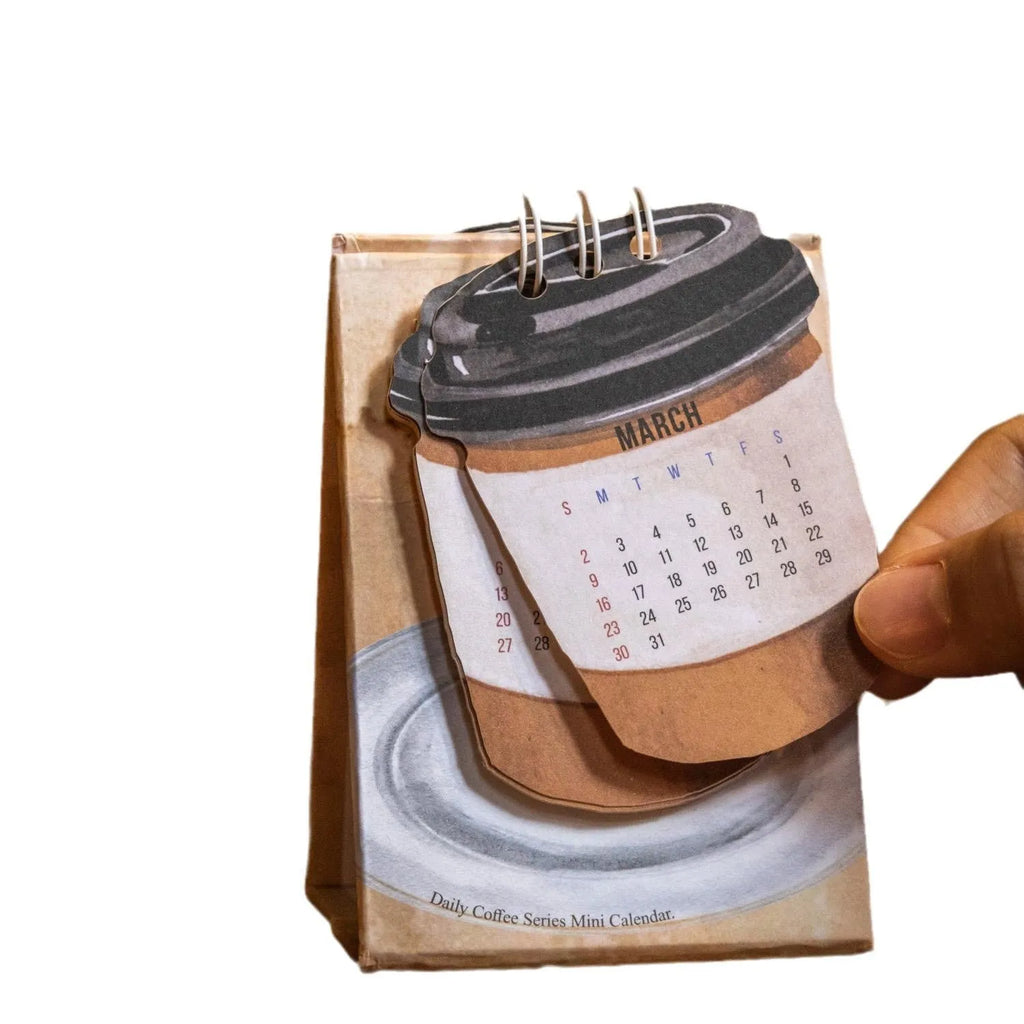 A5 size 2025 mini desk calendar open to a page showing a date and motivational quote.