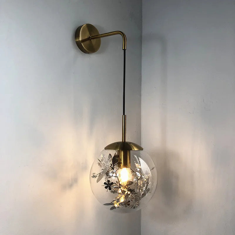 Modern glass wall lamp in golden flower finish, 20cm diameter, mounted on wall