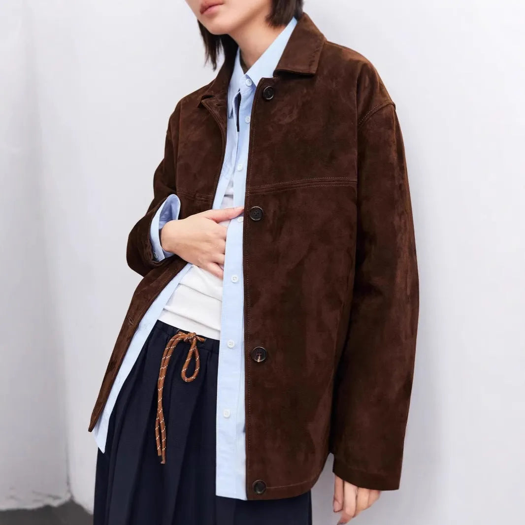 Women's loose-fit caramel mocha cashmere coat with a Peter Pan collar belt and leather stitching.