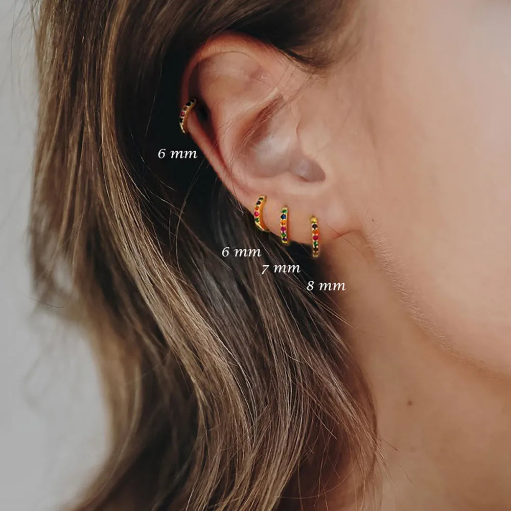 Circle zircon perforated stud earrings showing gold, rose gold and silver colour options with different diameter sizes