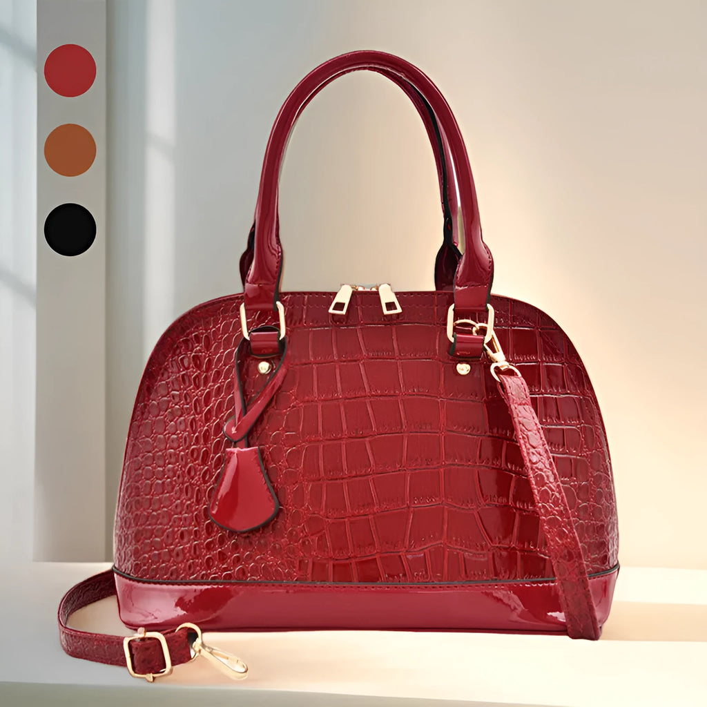 Large shiny black PU leather crossbody shoulder bag with shell shape on a white background