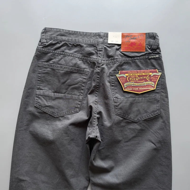 Men's straight leg casual cotton trousers in army green colour, showing mid waist and full length.