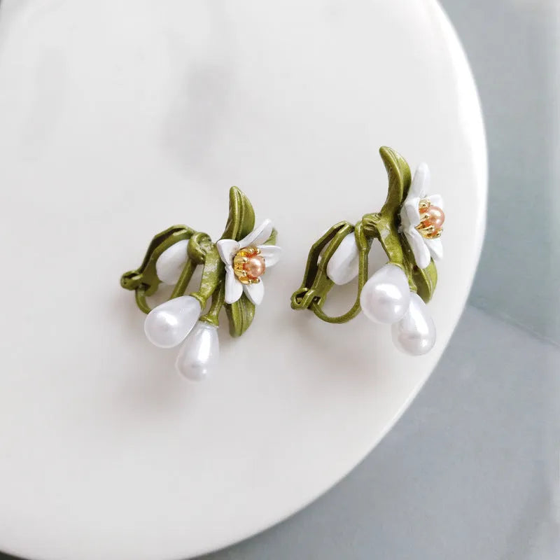 Women's camellia flower earrings in alloy with floral design and two colour options