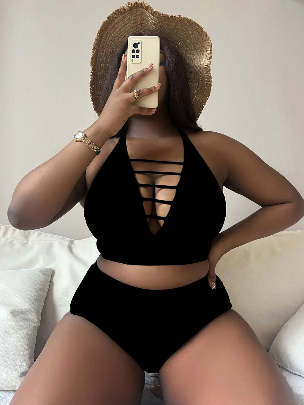 Plus size women's bikini with adjustable halter straps and high waist bottoms in solid colour