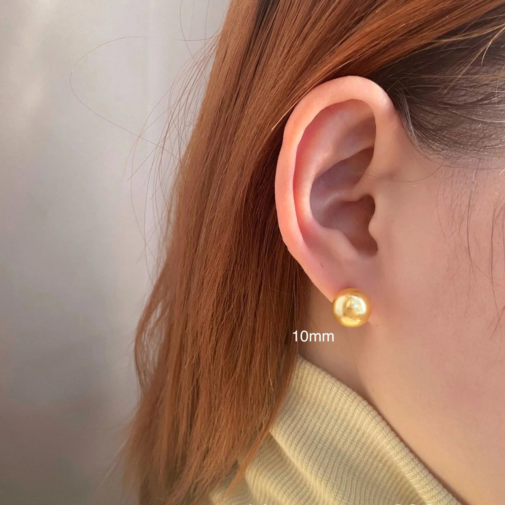 Large geometric pearl stud earrings with an Awn star setting in silver, shown in different size options.
