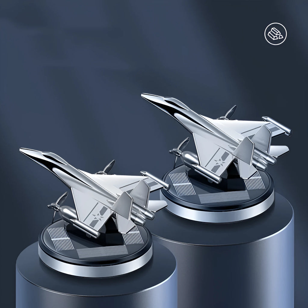 Silver solar powered rotating fighter jet perfume ornament on a beech wood base.