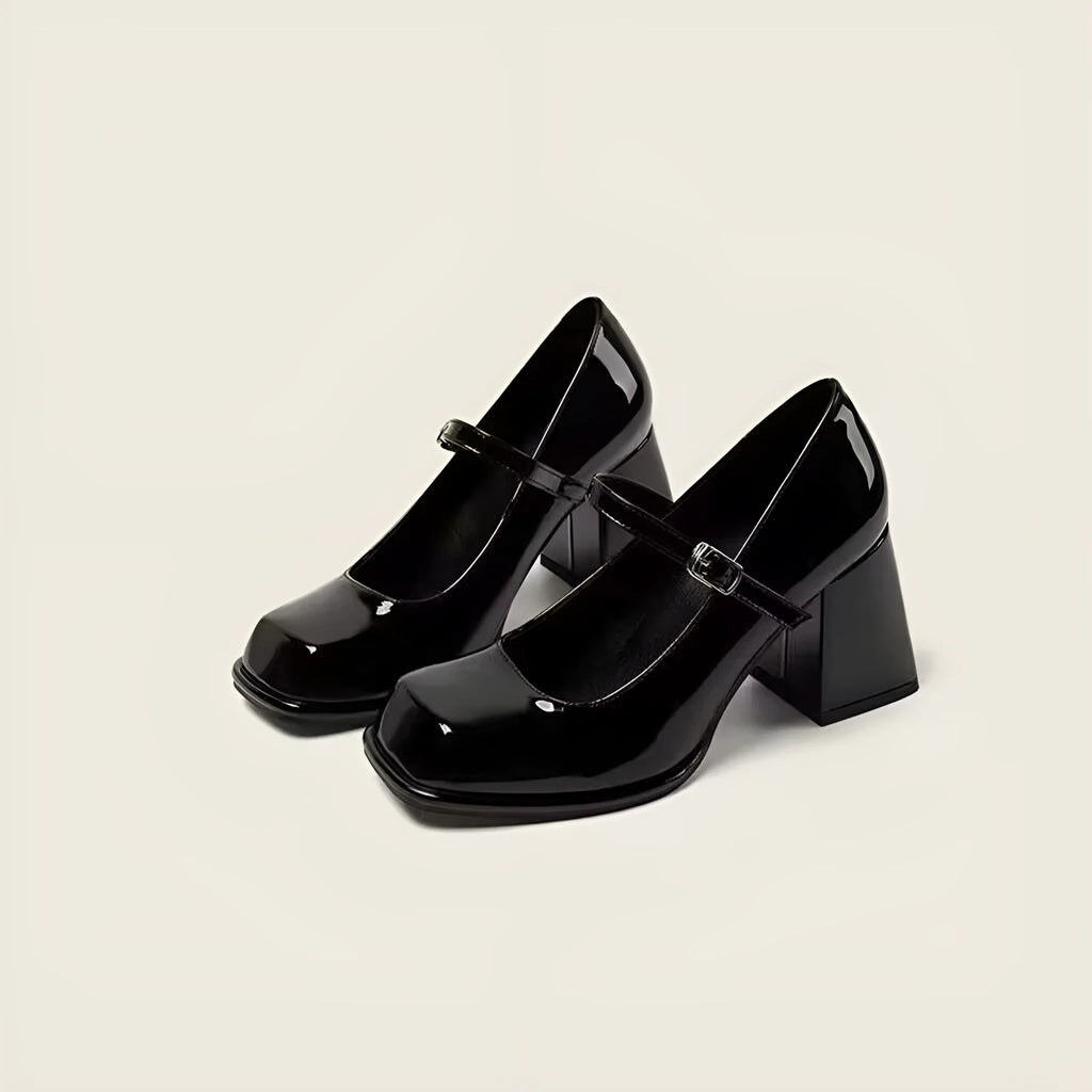 Women's retro black square toe chunky heel shoes with PU upper and buckle fastening on a white background
