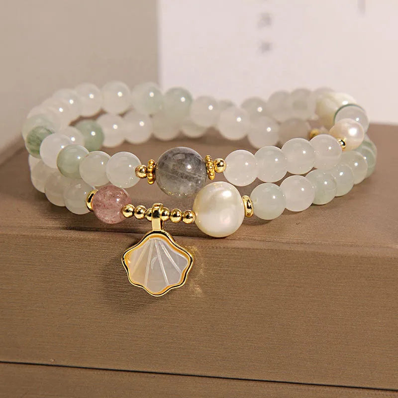 Women's crystal bracelet with gold-plated Tianshan jade shell ginkgo leaf pendant and rhinestone accents