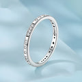 Silver alloy Moss Password I Love You ring with black oxidation treatment on a model's finger.