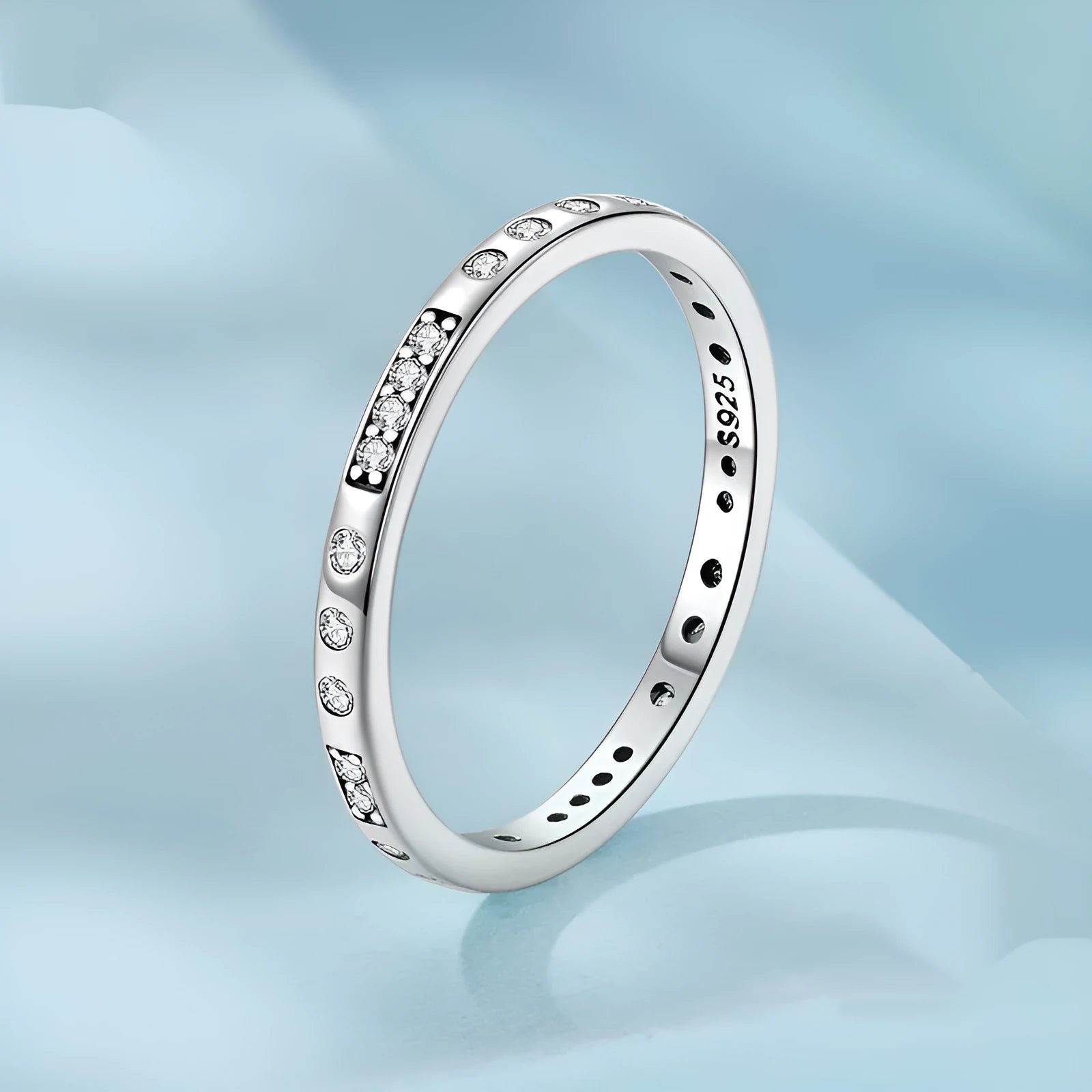 Silver alloy Moss Password I Love You ring with black oxidation treatment on a model's finger.