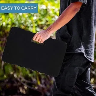 Blue plastic garden kneeler pad on grass, showing its size and thickness for knee protection during gardening.