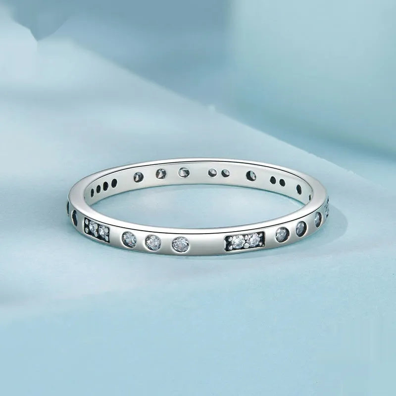 Silver alloy Moss Password I Love You ring with black oxidation treatment on a model's finger.