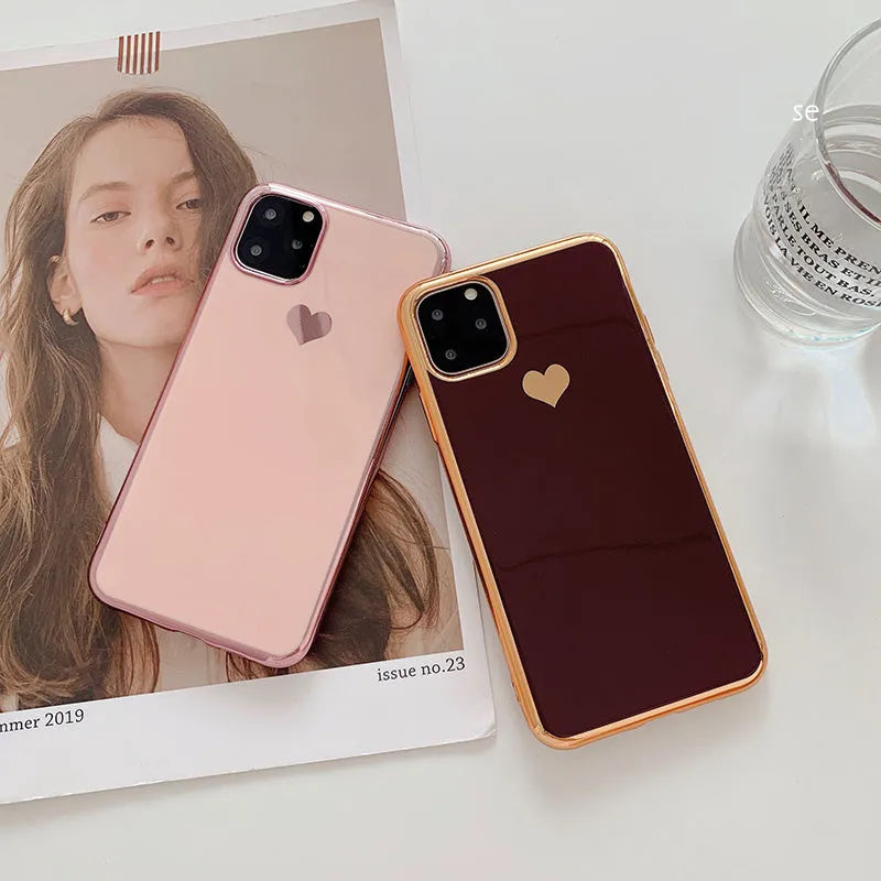 Solid colour blue TPU iPhone back cover case shown next to a claret pink and green version.