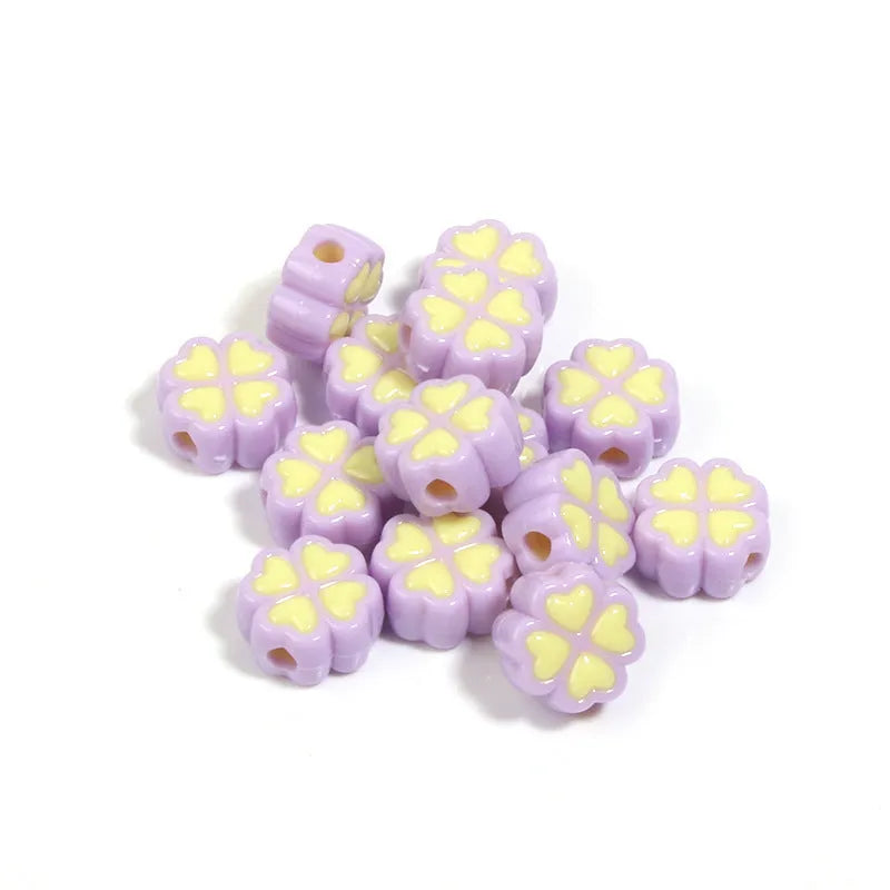 Assortment of 15mm frosted acrylic four-leaf clover beads in pink, yellow, green, blue, purple, and rose red.