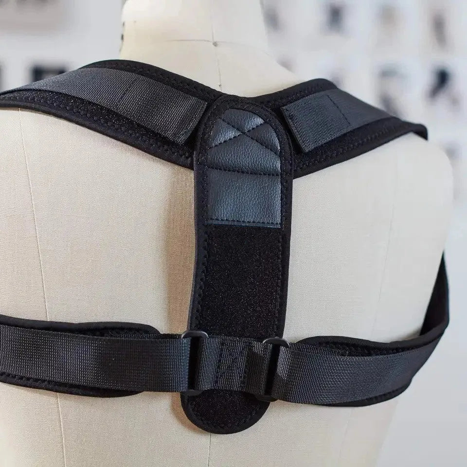 Black adjustable posture correction strap for back support and spinal alignment