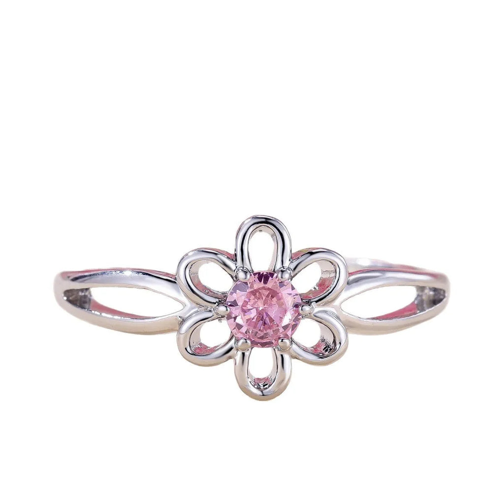Lady's copper flower hollowed ring with electroplated finish in white gold powder colour on white background