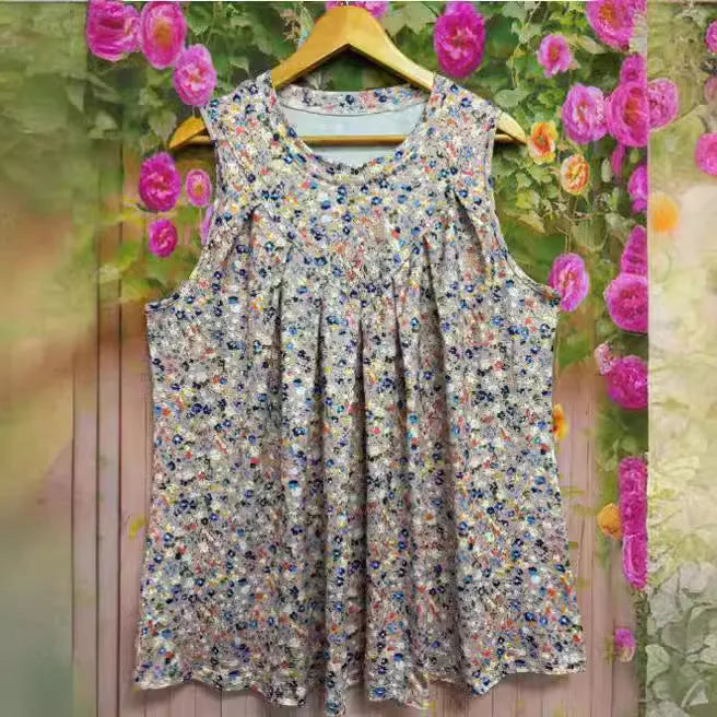 Black plus size floral print sleeveless vest with round neck on a hanger.