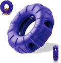 Blue durable natural rubber dog chew toy shaped like a tyre with oval openings.