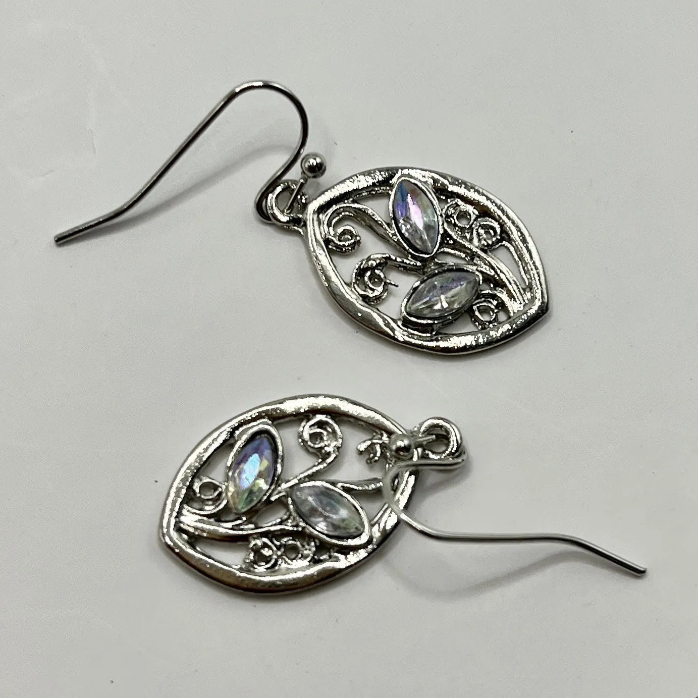 Silver leaf-shaped earrings with embedded colourful moonstone stones, European design