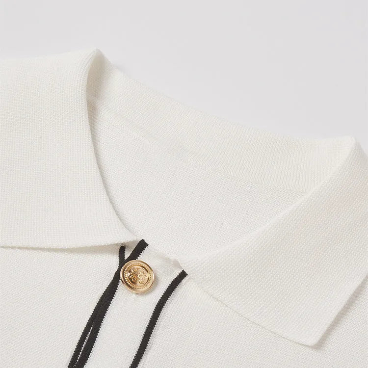 White short sleeve cardigan with dark contrast trim on the lapels.