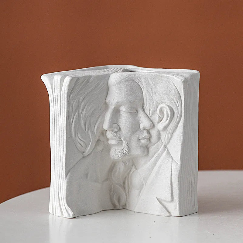 A glazed ceramic book stand in a modern design, holding a book upright on a desk.