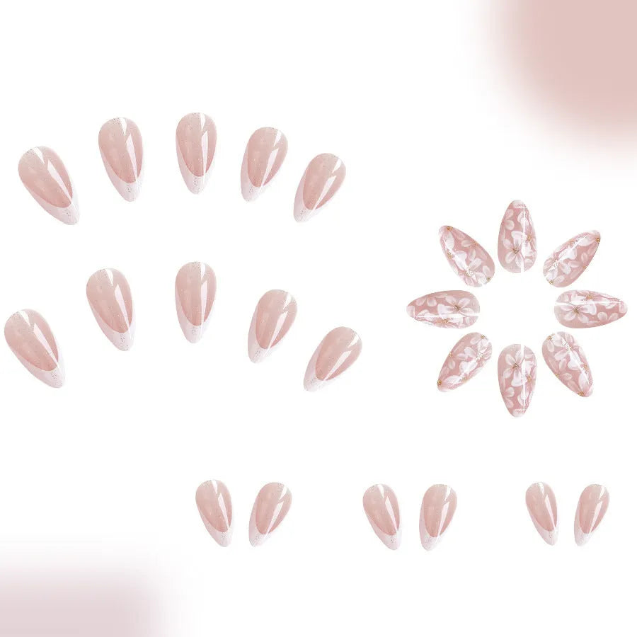 Short almond shaped French style artificial nails with glitter and flower pattern in colour C625