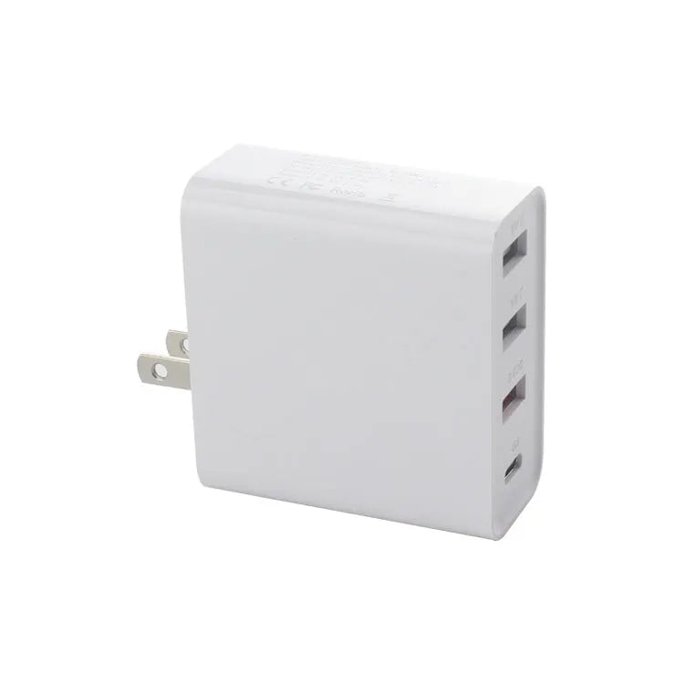 Black four-port USB-C wall charger with UK, EU, US, and AU plug adapters