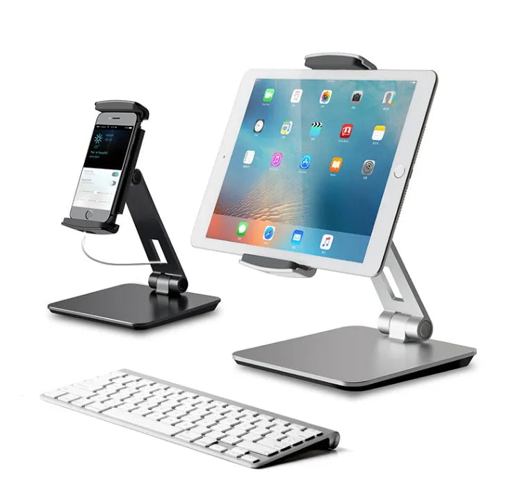 Silver folding aluminium phone and tablet stand with 360° rotation on wooden desk