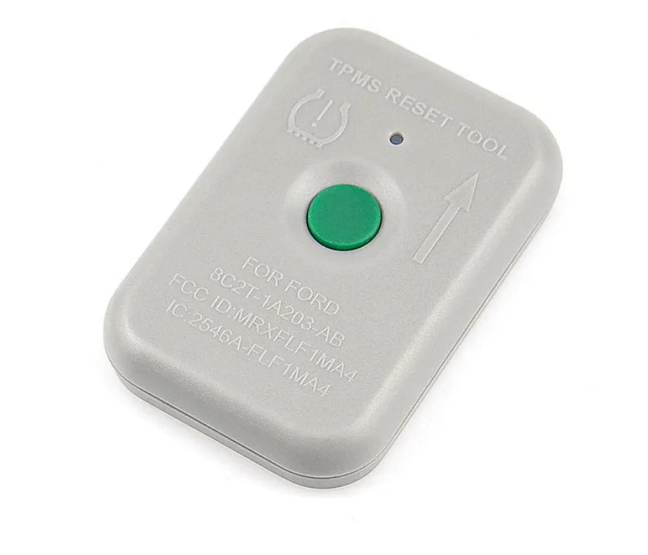 TPMS-19 TPMS activation tool for Ford, compact plastic tool approximately 5cm long, grey casing, single test button