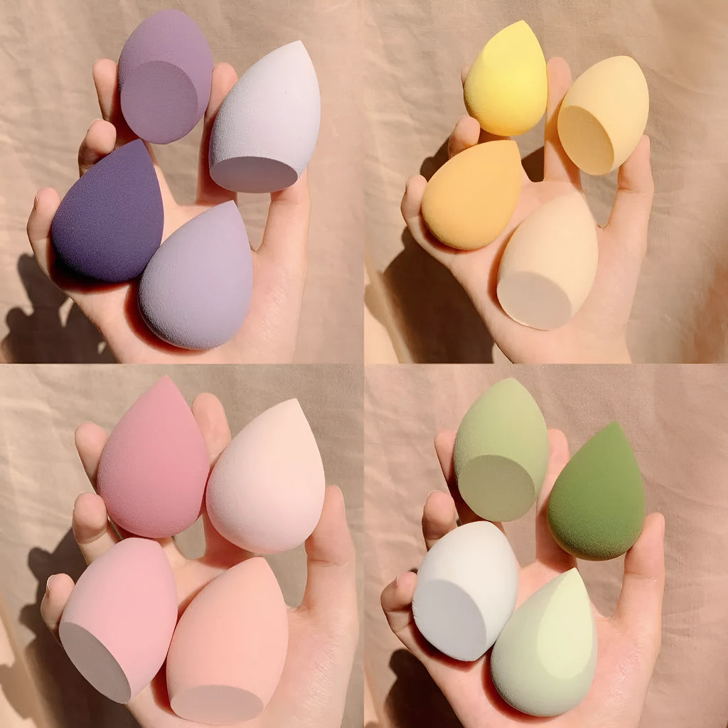 Four synthetic makeup sponges in grape, mango, mint, and peach colours, each measuring 6cm
