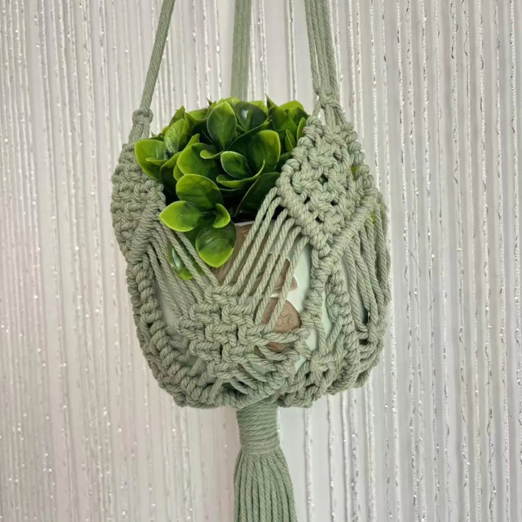 Hand-woven minimalist flower pot in a neutral colour with a woven net pocket extension cord.