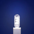 Compact LED night light with USB cable showing white and warm light colour options