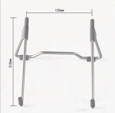 Grey aluminium alloy and plastic stand holding a mobile phone and a laptop.