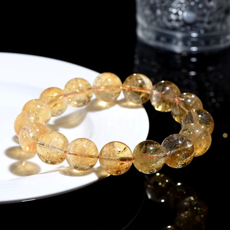 Natural yellow citrine bead bracelet showing options for single strand and triple strand styles.