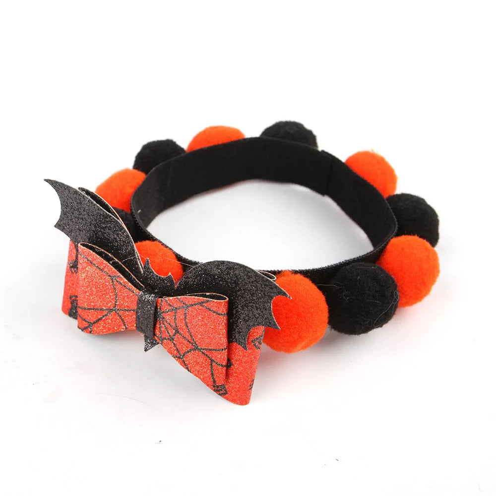 Halloween pet fur ball collar in coarse powder pumpkin colour on a cat, with soft textured design