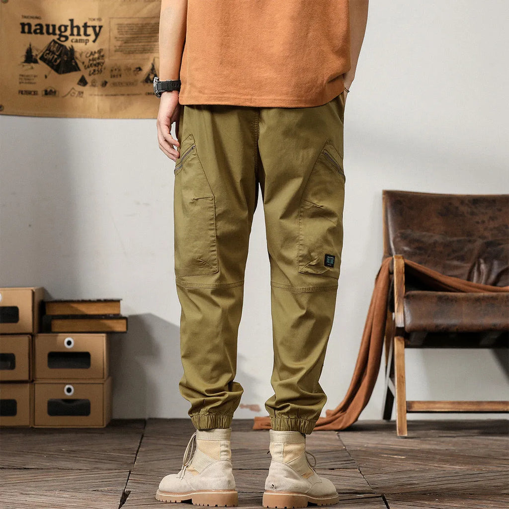 Men's cotton tapered harem pants in black colour with ankle bands and zip fly