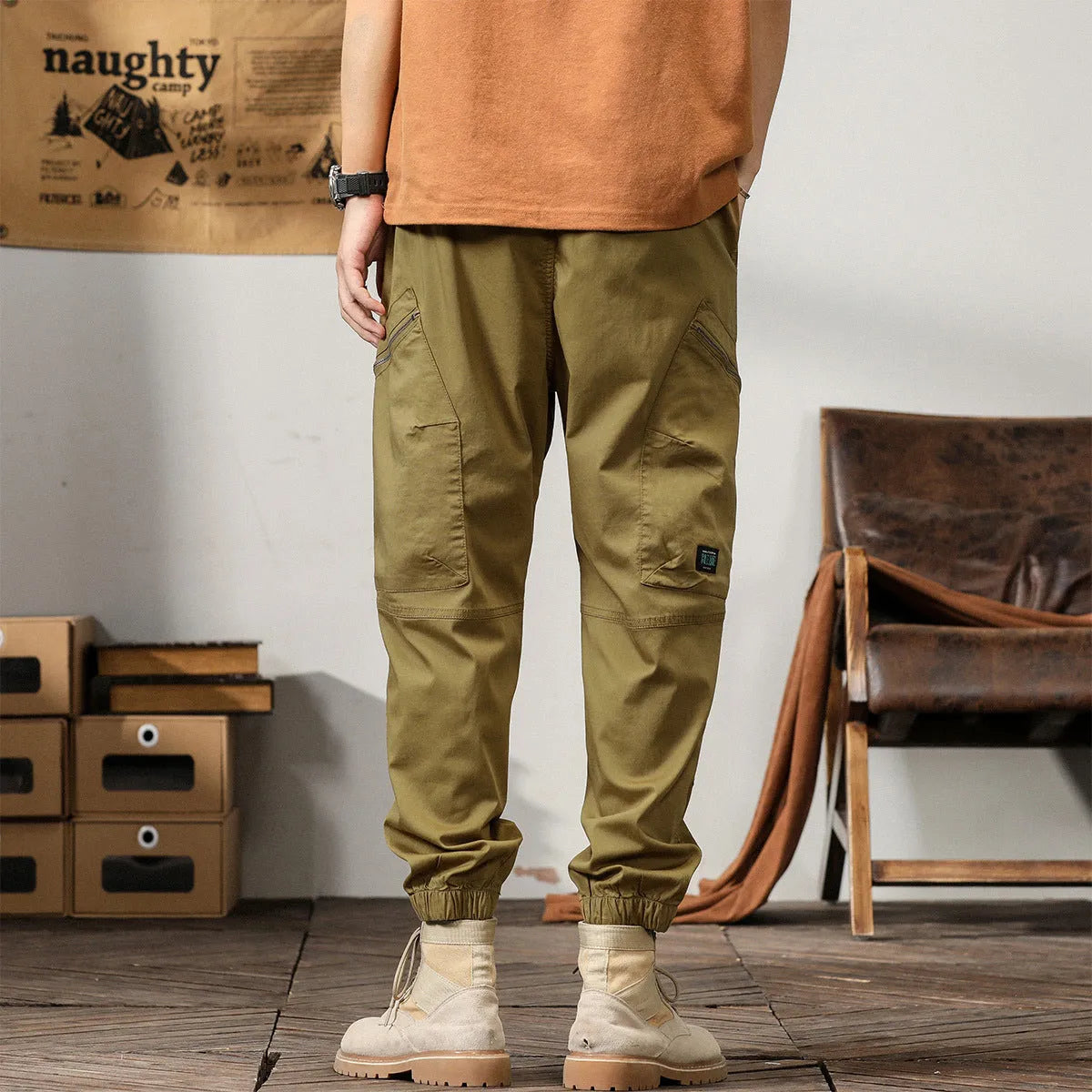 Men's cotton tapered harem pants in black colour with ankle bands and zip fly