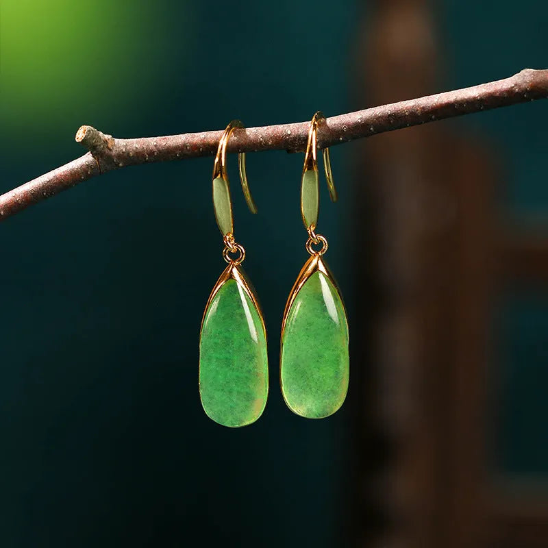 A pair of retro-style geometric water droplet earrings in jade green, made from electroplated copper.