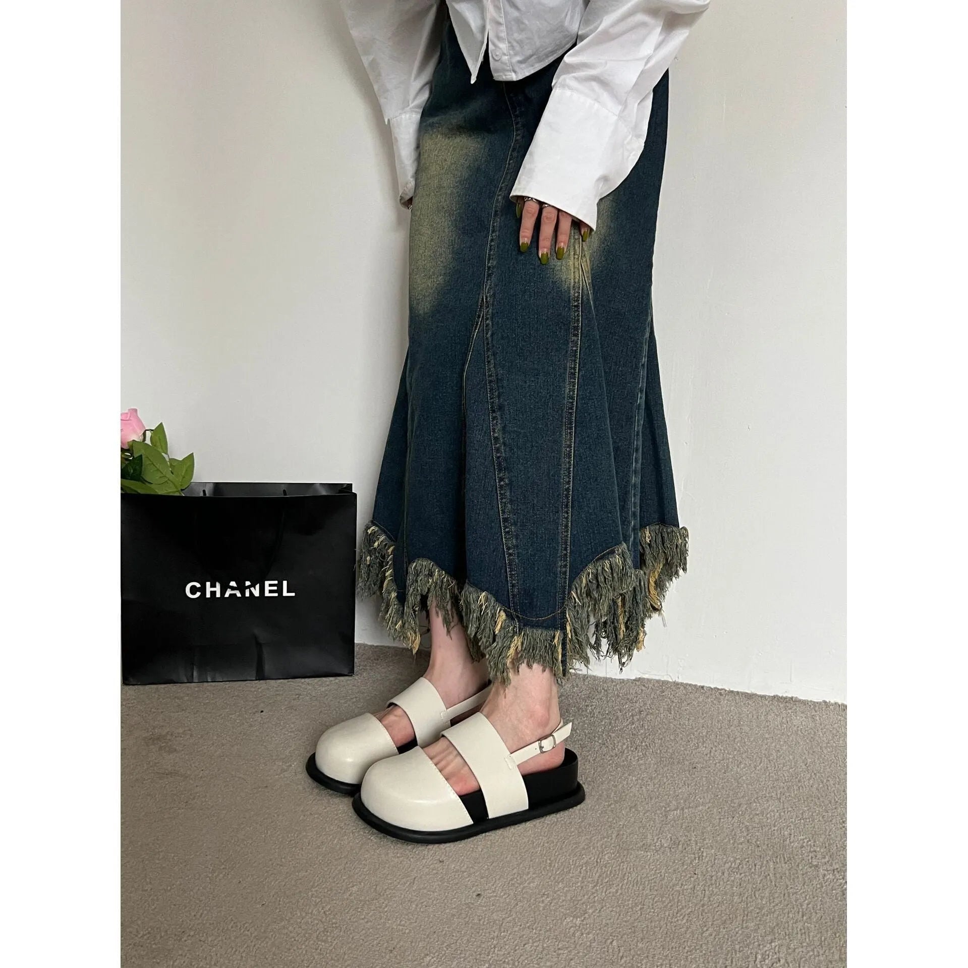 Retro women's sandals with a closed toe, ankle strap buckle, and platform sole in apricot colour.