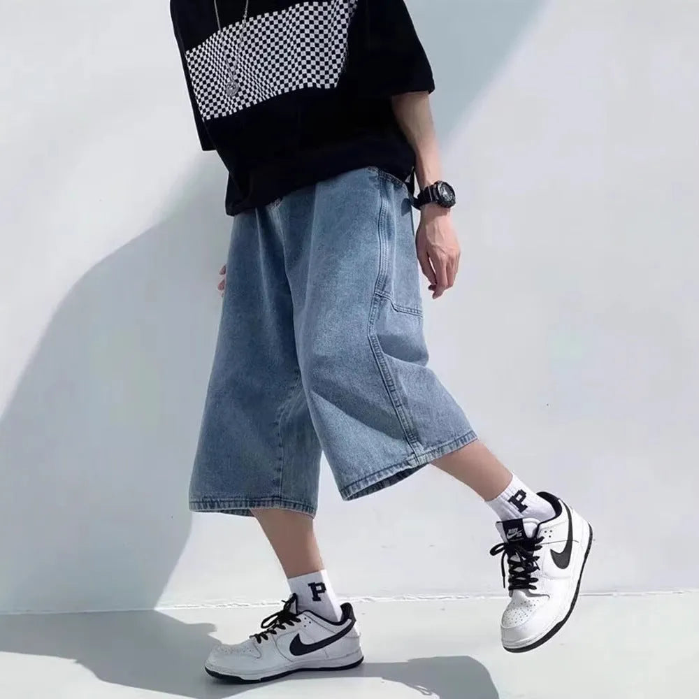 Blue men's high-waist washed denim pirate shorts with a cropped length and straight leg.