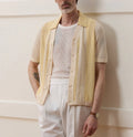 Hollow-out short-sleeved Tencel polo shirt in yellow with asymmetric design