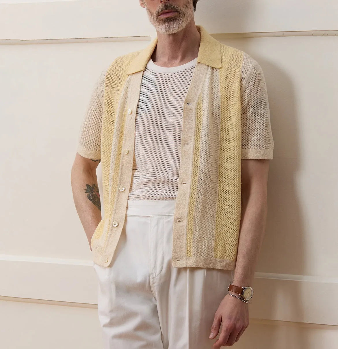 Hollow-out short-sleeved Tencel polo shirt in yellow with asymmetric design