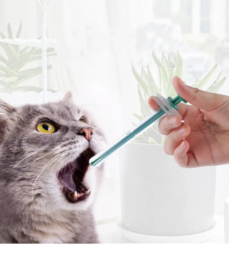 Two silica gel pet pill shooters with soft tips for administering medicine to cats and dogs.