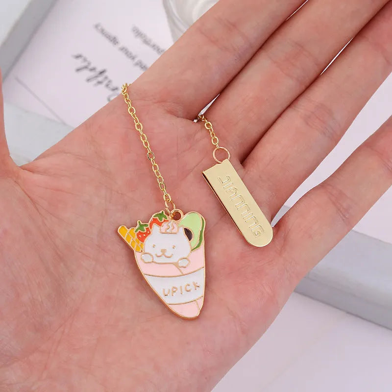 Jane Lime metal pendant cat cartoon bookmark in four colourful designs on a white background.