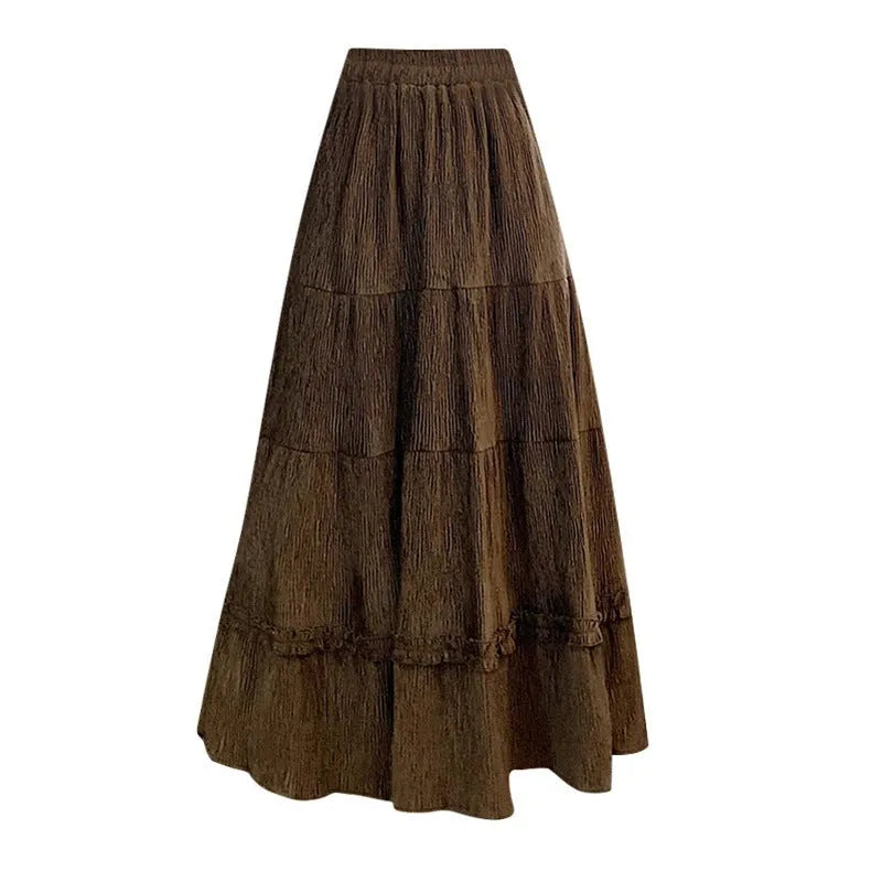 Solid colour corduroy A-line midi skirt with an elastic waistband, shown in a neutral colour.