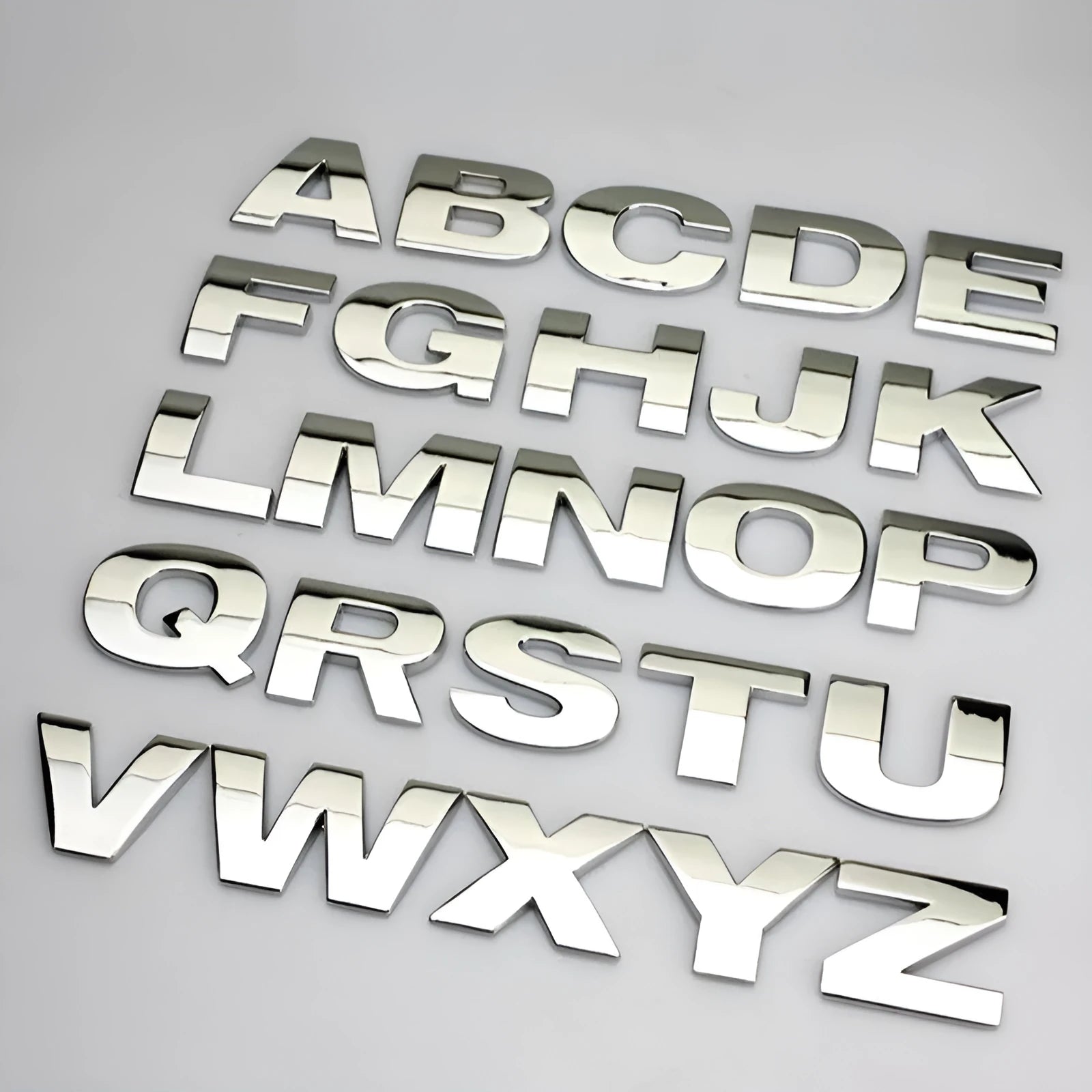 3D metal car bumper sticker showing dimensional English letter on car surface