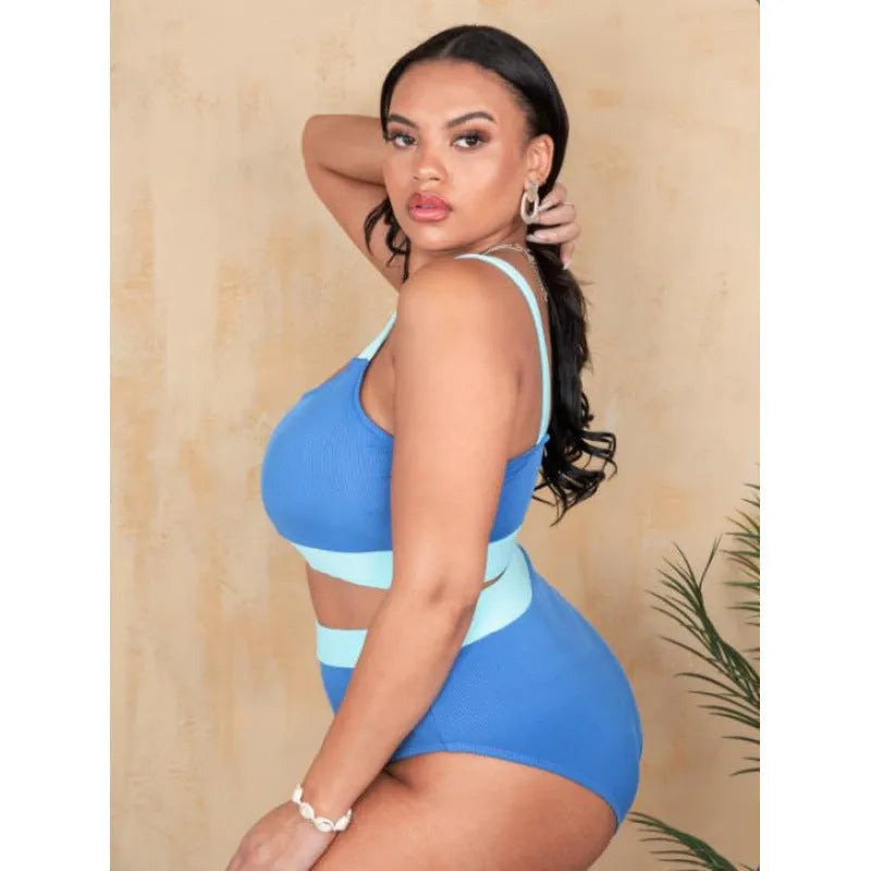 Women's solid colour high-waist polyester bikini brief suit with a side split detail.