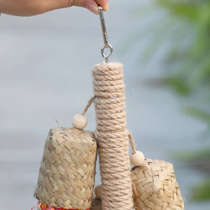 Wood and sisal parrot toy with shredded paper, measuring 15 by 35 centimetres
