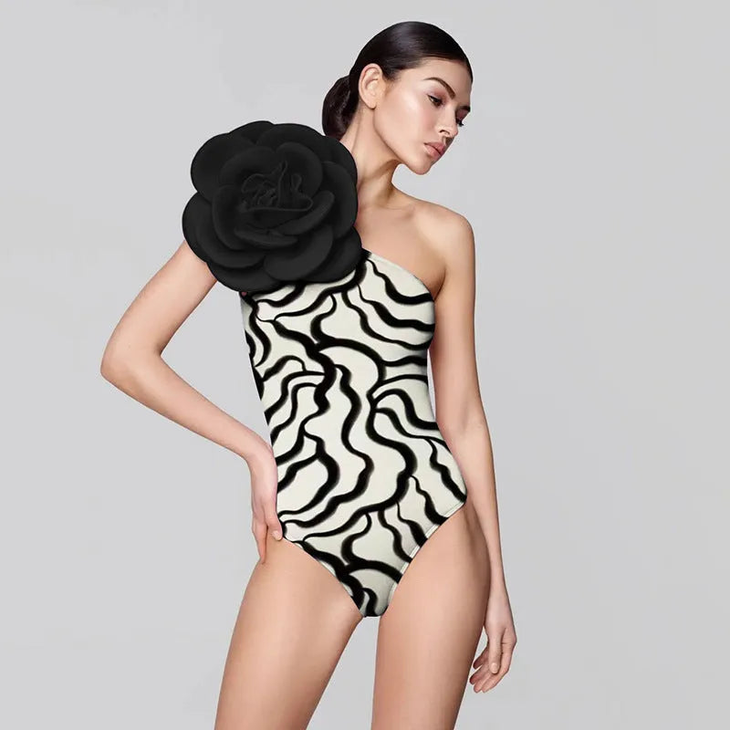 One-piece European American style swimsuit with three-dimensional floral patterns on solid colour background